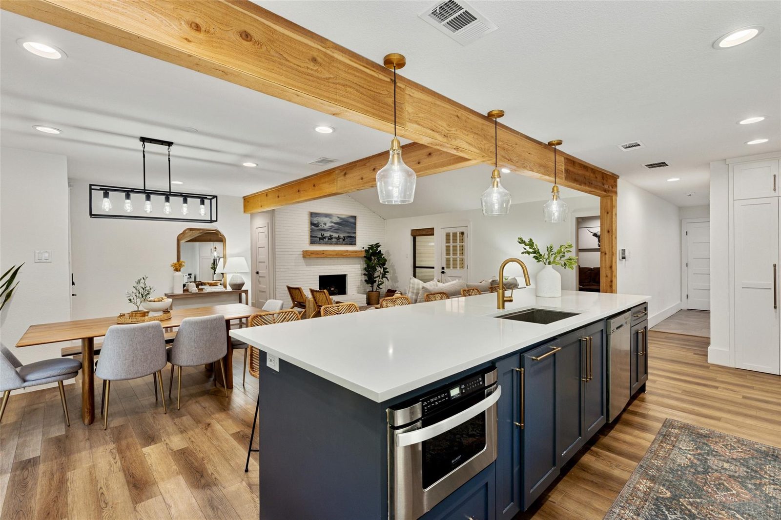 After: navy island, open sightline all the way to the living room